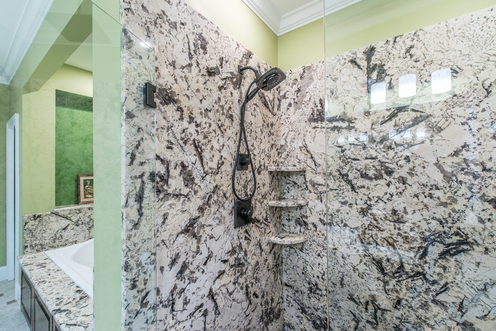 Photo of a large traditional master bathroom in Charleston with an open shower, green walls, a drop-in sink and granite benchtops.