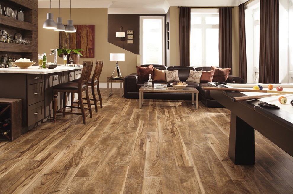 Example of a large transitional open concept light wood floor living room design in Cedar Rapids with a bar, beige walls, no fireplace and no tv