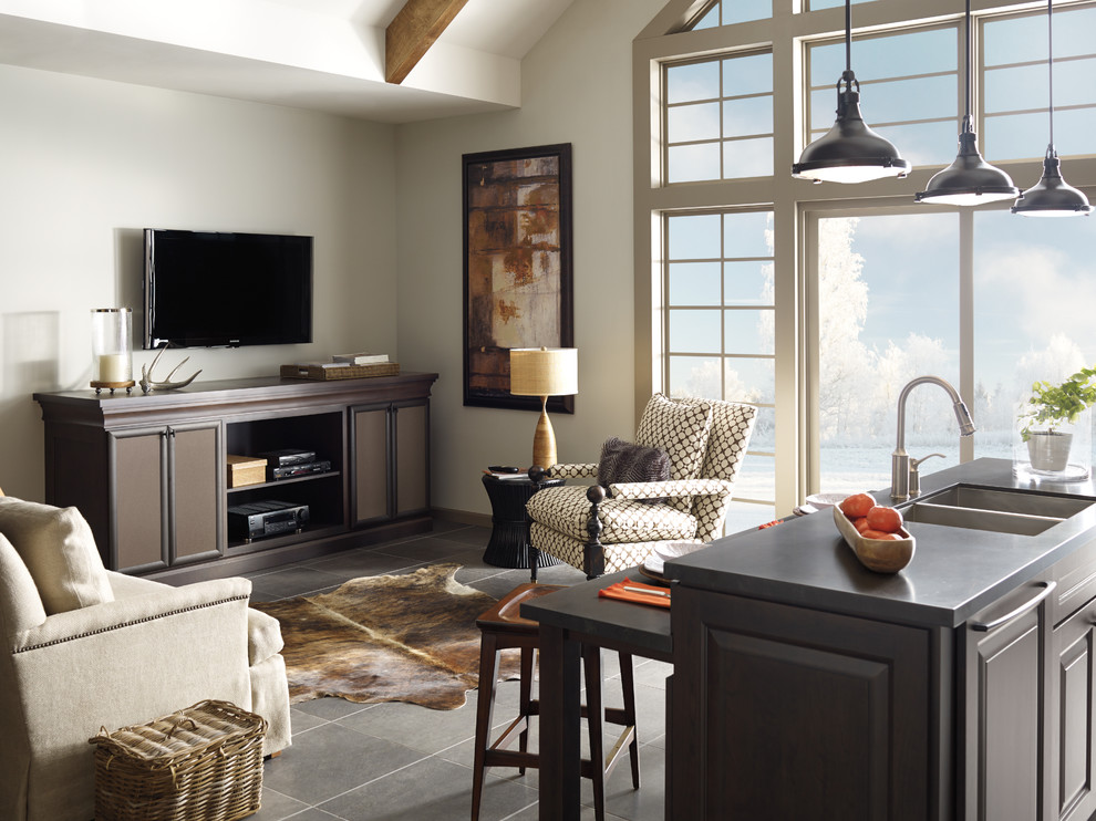 Inspiration for a large transitional single-wall porcelain tile open concept kitchen remodel in Toronto with a double-bowl sink, flat-panel cabinets, dark wood cabinets, soapstone countertops, brown backsplash, ceramic backsplash, stainless steel appliances and an island