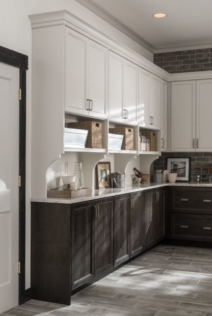 Mid-sized country l-shaped eat-in kitchen in New York with shaker cabinets, dark wood cabinets, granite benchtops, white splashback, ceramic splashback, dark hardwood floors, with island and brown floor.