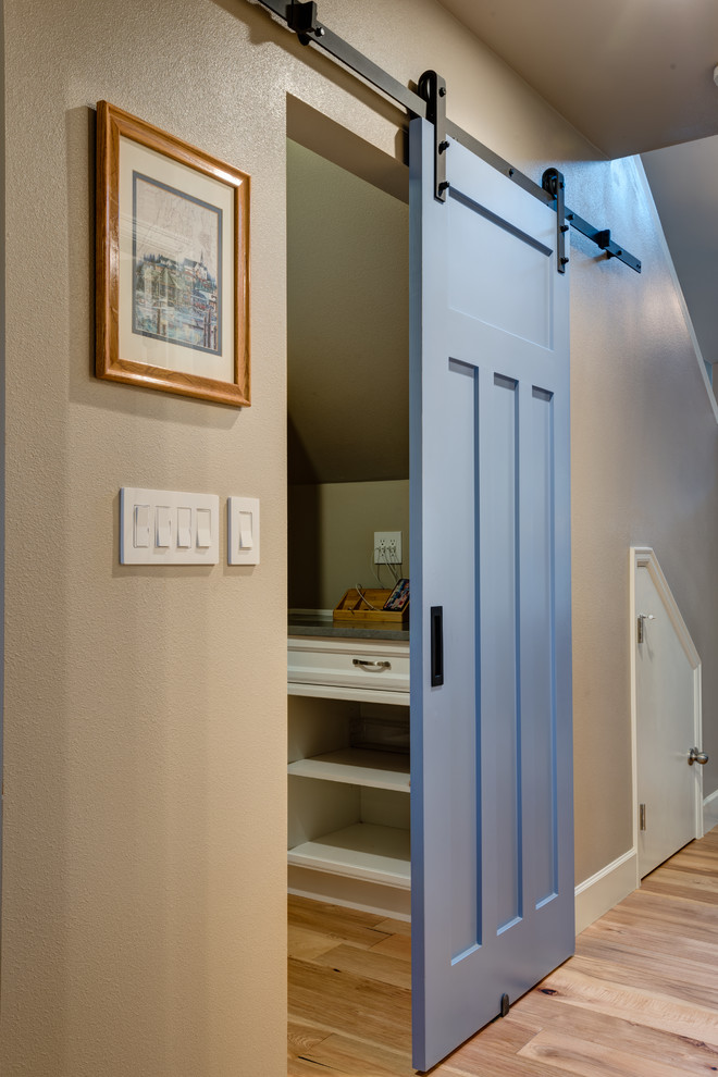 Large transitional u-shaped light wood floor eat-in kitchen photo in Seattle with an undermount sink, beaded inset cabinets, blue cabinets, quartz countertops, multicolored backsplash, porcelain backsplash, stainless steel appliances and an island