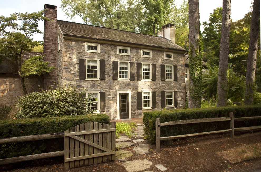 This is an example of a traditional exterior in New York with stone veneer.