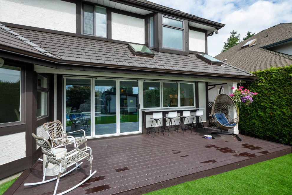 Example of a backyard deck design in Vancouver with no cover