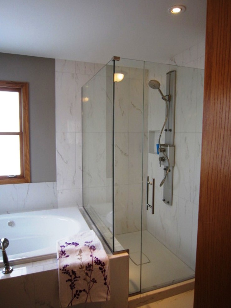 Design ideas for a contemporary master bathroom in Chicago with a drop-in tub, an open shower, white tile, ceramic tile and porcelain floors.