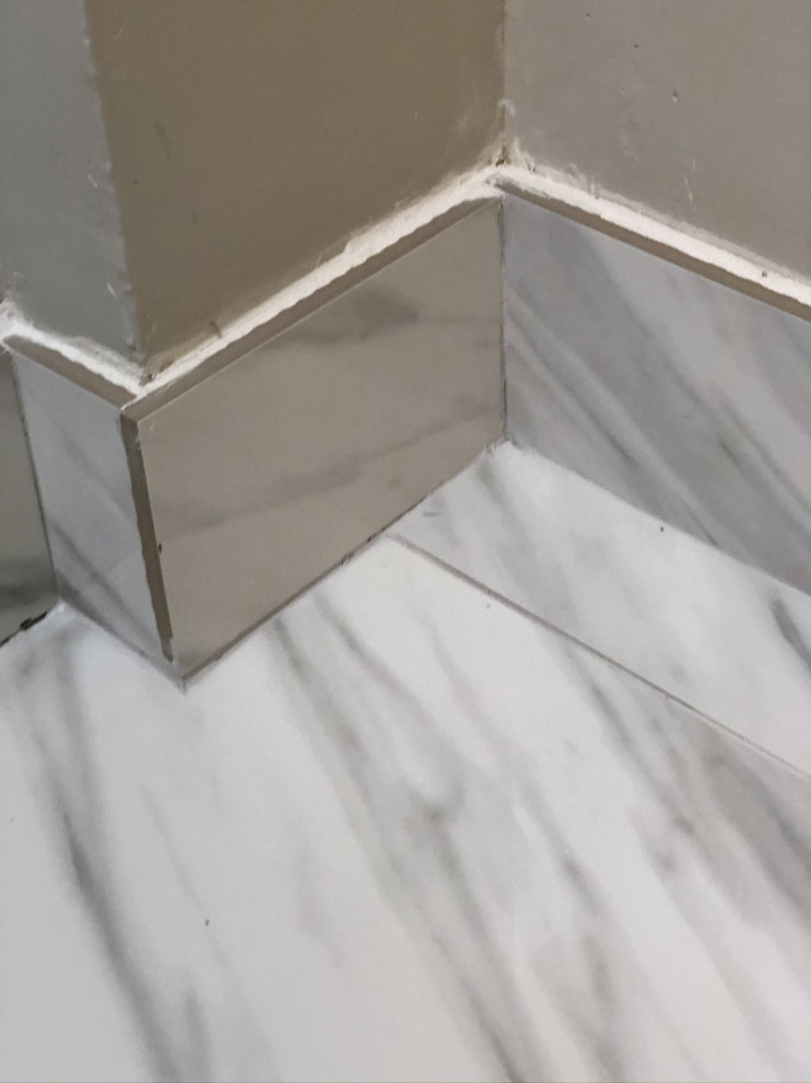 Huge gap between shower tile and drywall