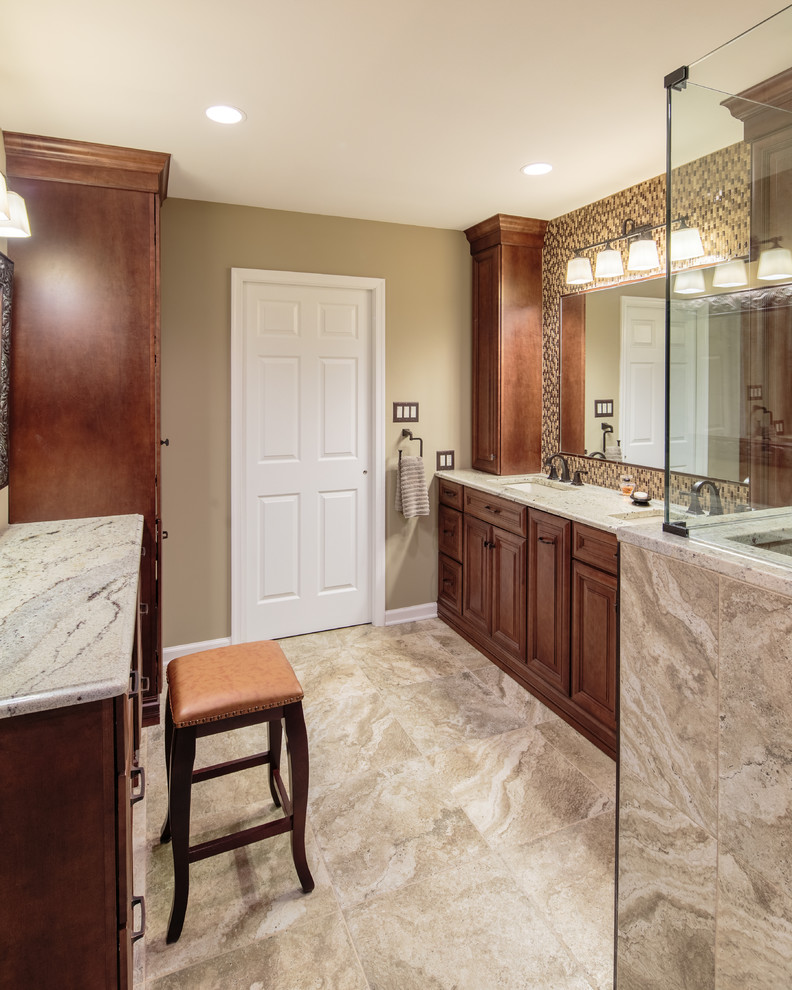 Mid-sized transitional master bathroom in Philadelphia with raised-panel cabinets, dark wood cabinets, a double shower, beige tile, brown walls, porcelain floors, an undermount sink, granite benchtops and glass tile.