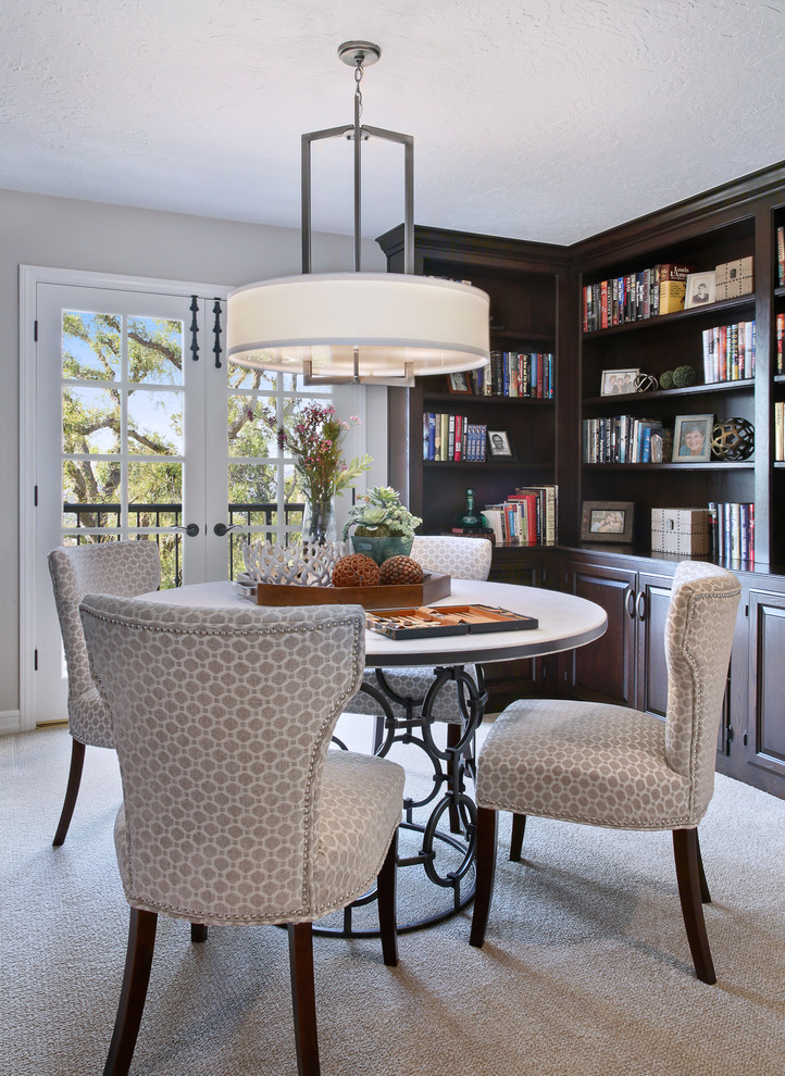 Inspiration for a small traditional home office in Orange County with a library, beige walls, carpet, no fireplace and beige floor.