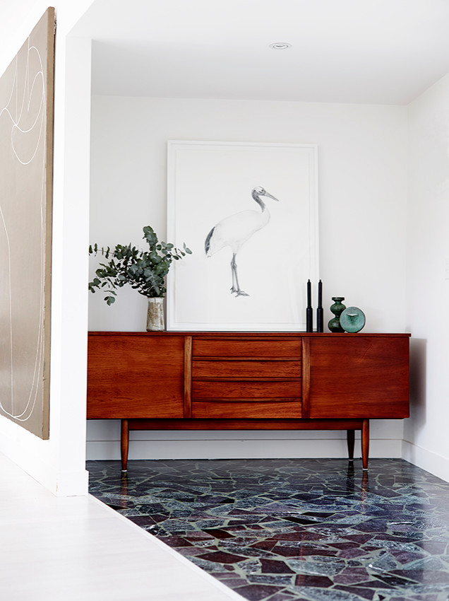 Photo of a mid-sized contemporary foyer in Melbourne with white walls, terrazzo floors, a double front door, a white front door and multi-coloured floor.