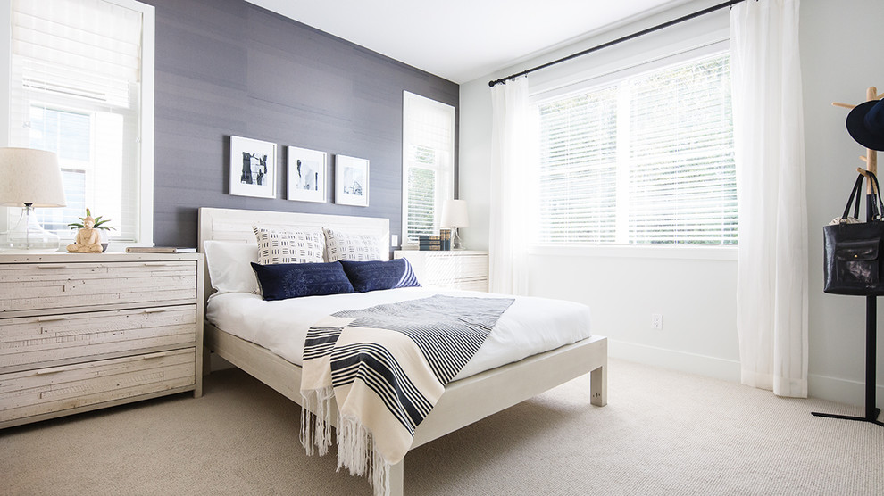 Design ideas for a mid-sized transitional guest bedroom in Vancouver with blue walls and carpet.