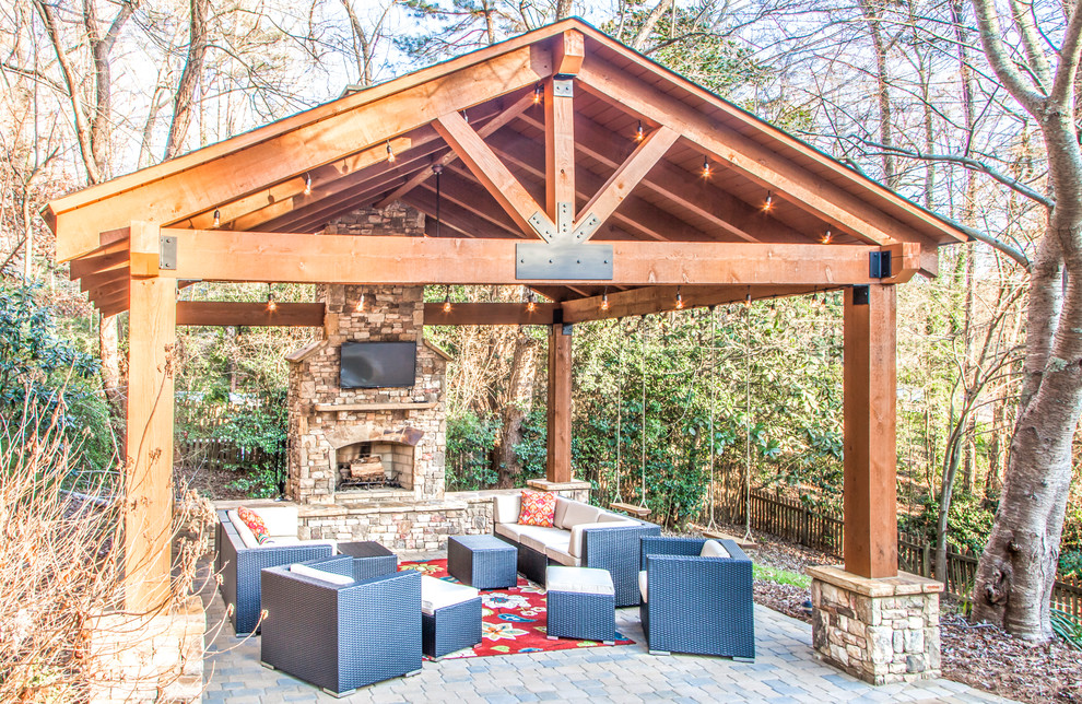 Photo of a large arts and crafts backyard patio in Atlanta with a fire feature, brick pavers and a gazebo/cabana.
