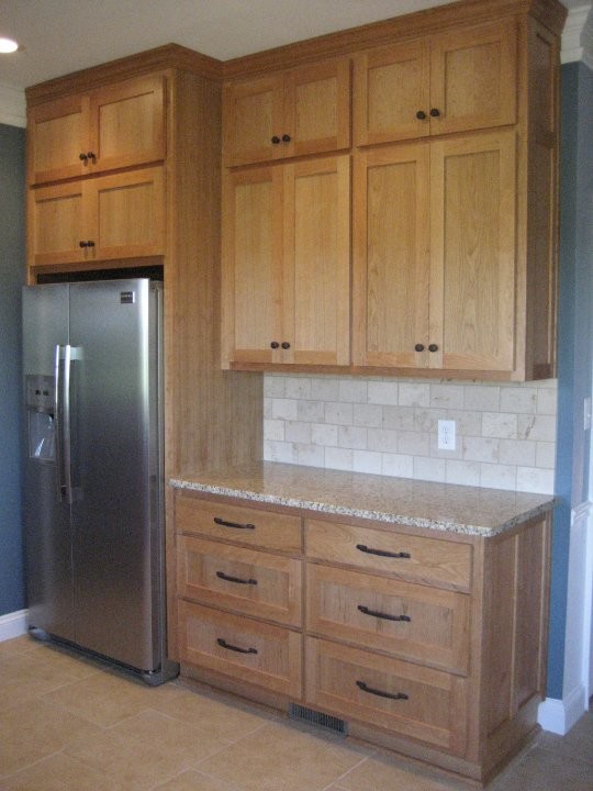 Inspiration for a transitional porcelain tile kitchen remodel in Baltimore with an undermount sink, shaker cabinets, granite countertops and stainless steel appliances