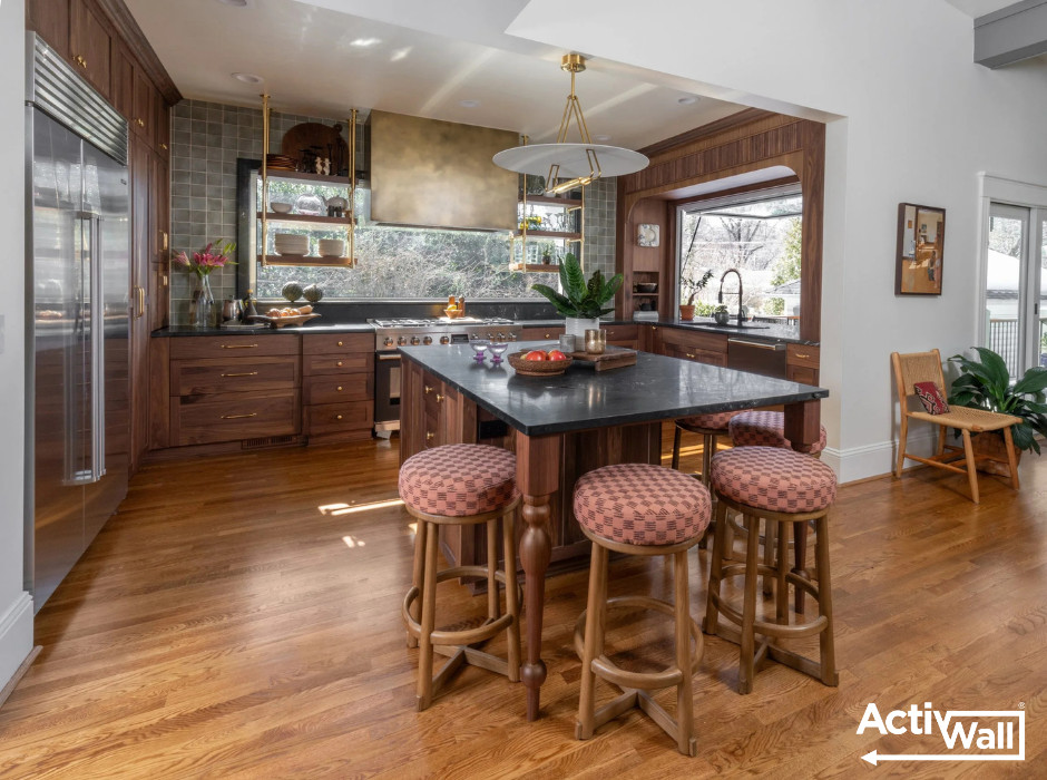 Open concept kitchen - mid-sized eclectic u-shaped medium tone wood floor and brown floor open concept kitchen idea with recessed-panel cabinets, brown cabinets, green backsplash, ceramic backsplash, stainless steel appliances, an island and black countertops