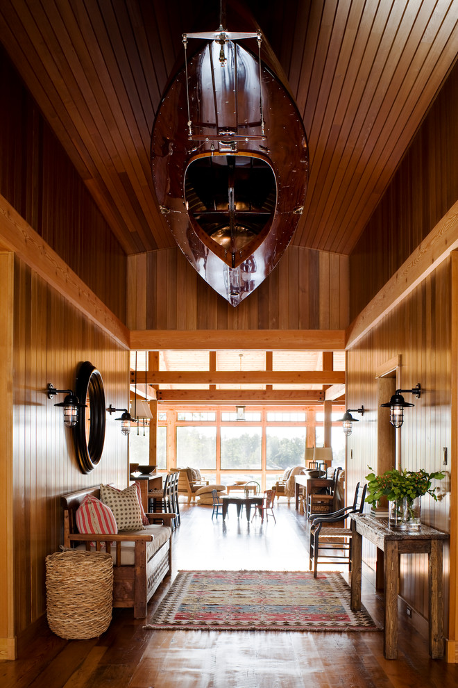 Mountain style medium tone wood floor entry hall photo in Toronto