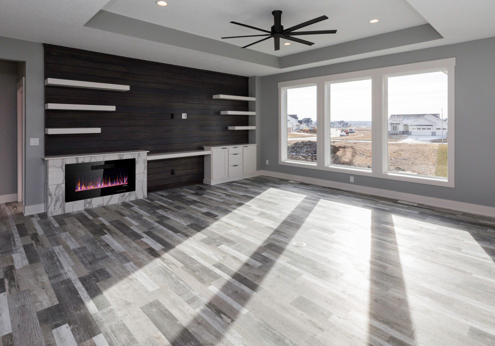 Inspiration for a large modern open concept living room in Other with grey walls, vinyl floors, a ribbon fireplace, a tile fireplace surround, a built-in media wall and grey floor.