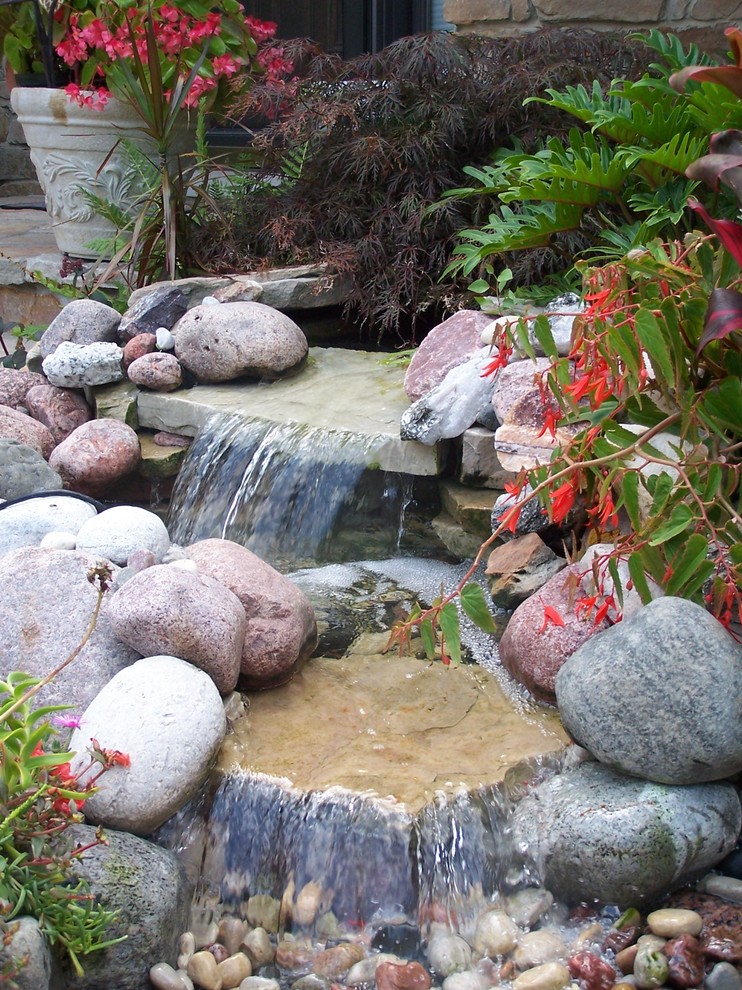 This is an example of a traditional garden in Chicago with with pond.