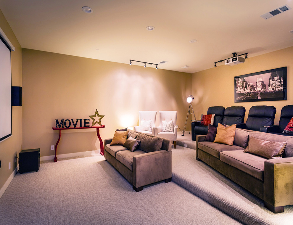 Photo of a mid-sized contemporary enclosed home theatre in San Francisco with beige walls, carpet, a projector screen and grey floor.