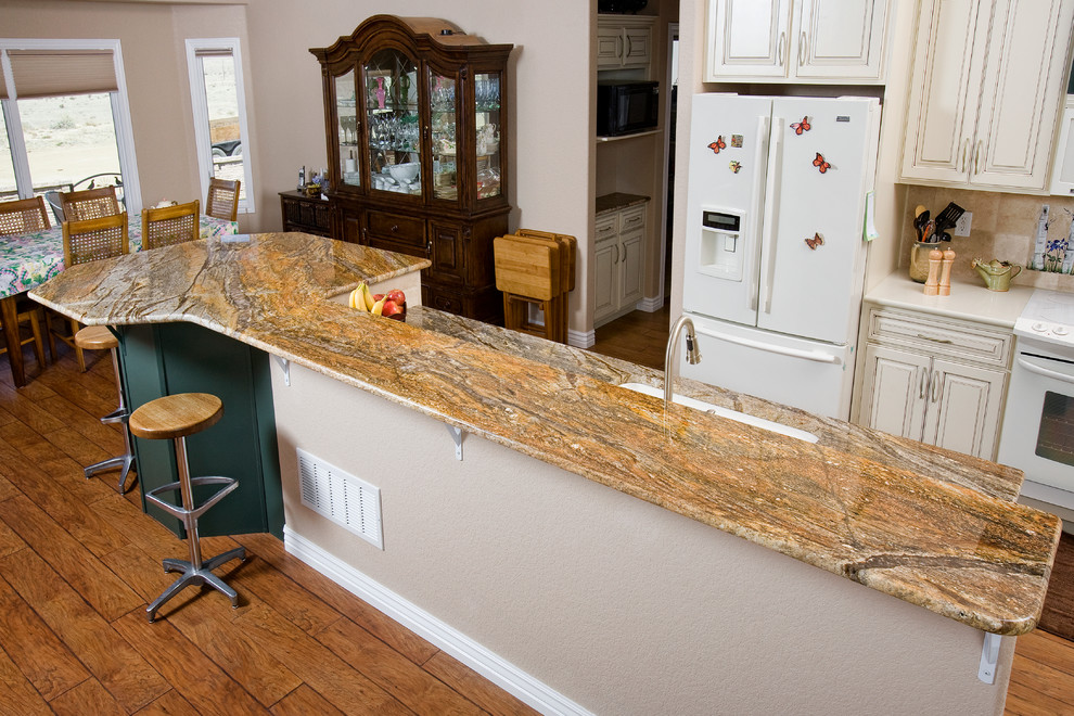 Example of a transitional kitchen design in Denver