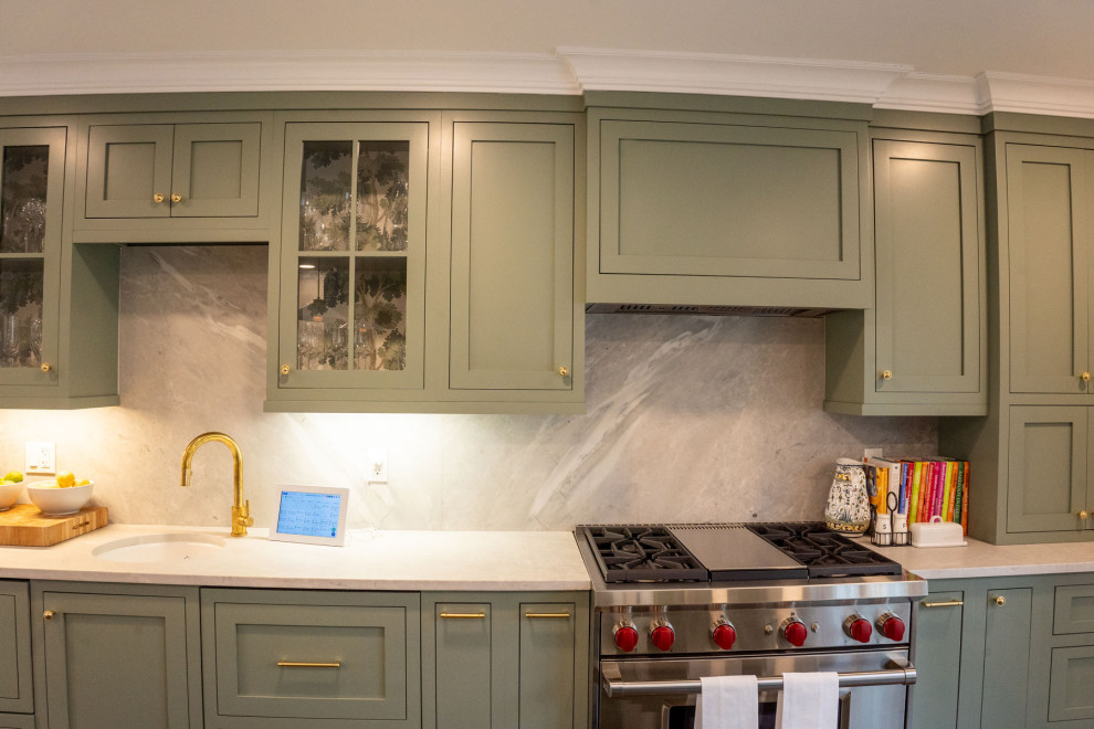 Photo of a transitional eat-in kitchen in New York with green cabinets, quartzite benchtops, with island and white benchtop.