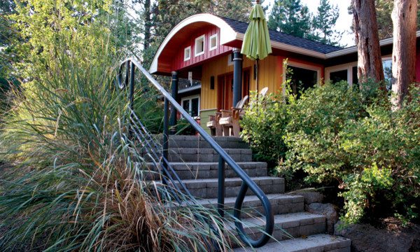 Design ideas for a mid-sized modern one-storey multi-coloured exterior in Other with wood siding.