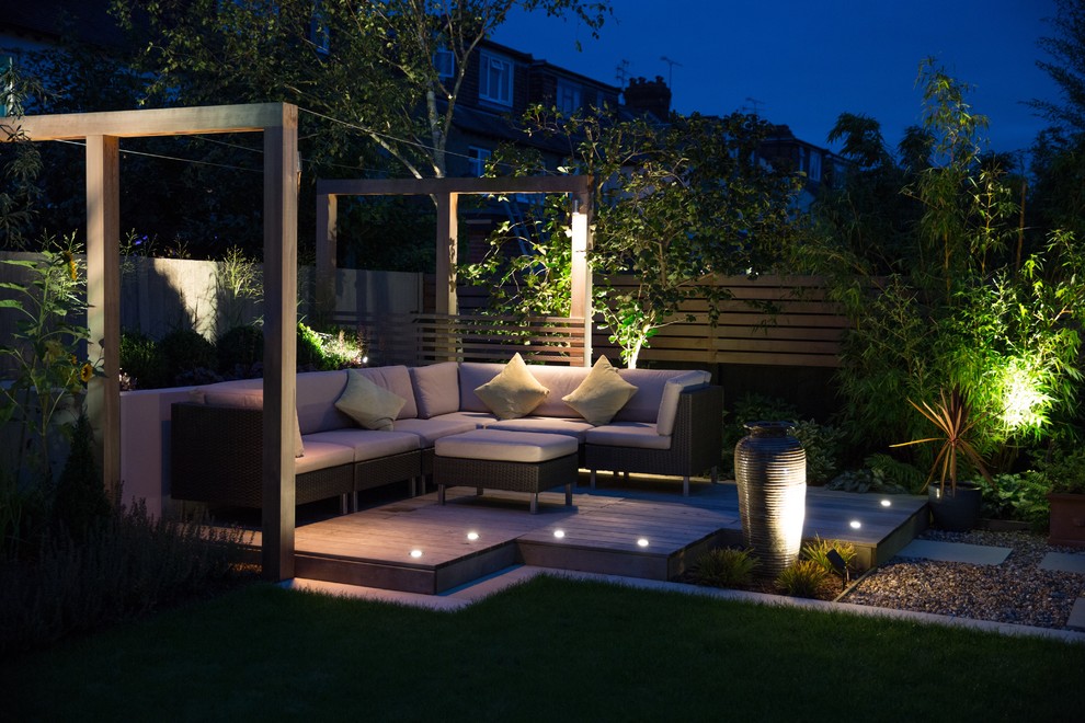 Small contemporary backyard partial sun formal garden in Cheshire with natural stone pavers.