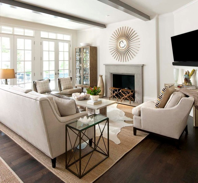 This is an example of a mid-sized contemporary open concept living room in San Luis Obispo with white walls, dark hardwood floors, a standard fireplace, a concrete fireplace surround, a wall-mounted tv and brown floor.