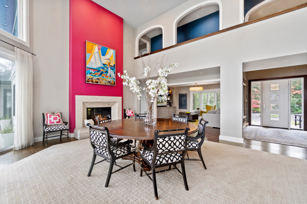 Inspiration for an expansive beach style dining room in Baltimore with pink walls, carpet, a two-sided fireplace, a plaster fireplace surround and grey floor.