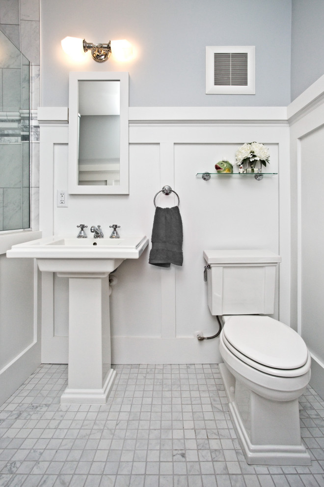 Inspiration for a transitional bathroom in Minneapolis with a two-piece toilet, grey walls, mosaic tile floors, a pedestal sink, white floor, a single vanity and decorative wall panelling.