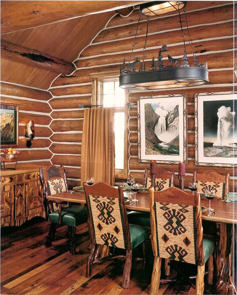 Kitchen/dining room combo - mid-sized rustic medium tone wood floor kitchen/dining room combo idea with a standard fireplace and a stone fireplace