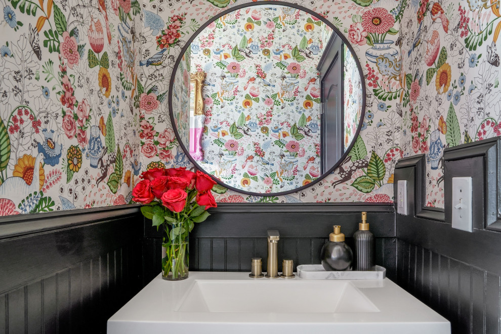 Design ideas for a small eclectic 3/4 bathroom in Atlanta with a drop-in tub, a shower/bathtub combo, black tile, black walls, ceramic floors, black floor, white benchtops, a single vanity, a freestanding vanity and wallpaper.
