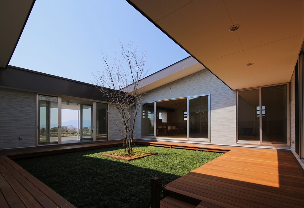 This is an example of a modern courtyard garden with decking.