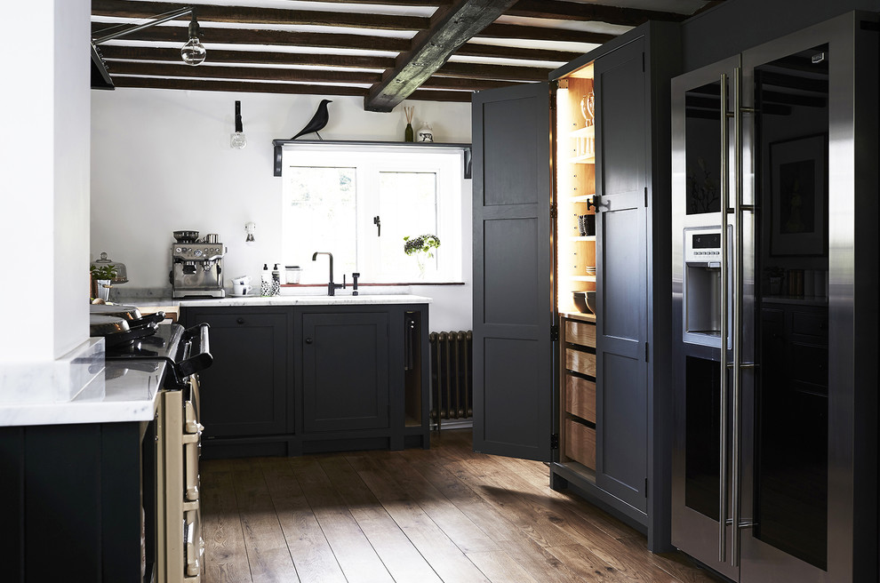 Design ideas for a mid-sized country u-shaped separate kitchen in Hampshire with a drop-in sink, shaker cabinets, green cabinets, marble benchtops, coloured appliances, dark hardwood floors, no island, white splashback, marble splashback and brown floor.