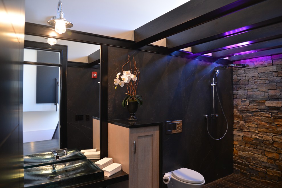 Large transitional master brown tile and ceramic tile ceramic tile wet room photo in Chicago with recessed-panel cabinets, light wood cabinets, a wall-mount toilet, brown walls, a vessel sink and granite countertops