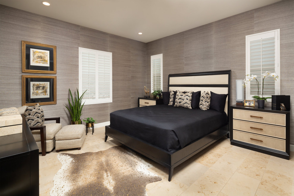 This is an example of a large contemporary guest bedroom in Orange County with limestone floors, blue floor and grey walls.