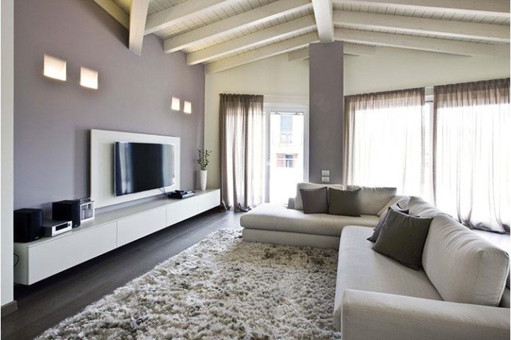 This is an example of a contemporary family room in Milan.