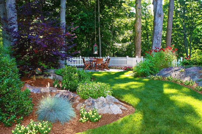 Large backyard partial sun garden in New York with a vegetable garden and brick pavers.