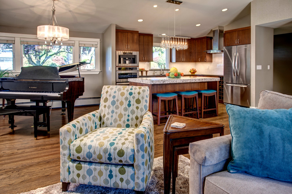 Inspiration for a small transitional l-shaped medium tone wood floor open concept kitchen remodel in Seattle with a single-bowl sink, flat-panel cabinets, dark wood cabinets, quartz countertops, white backsplash, ceramic backsplash, stainless steel appliances and an island