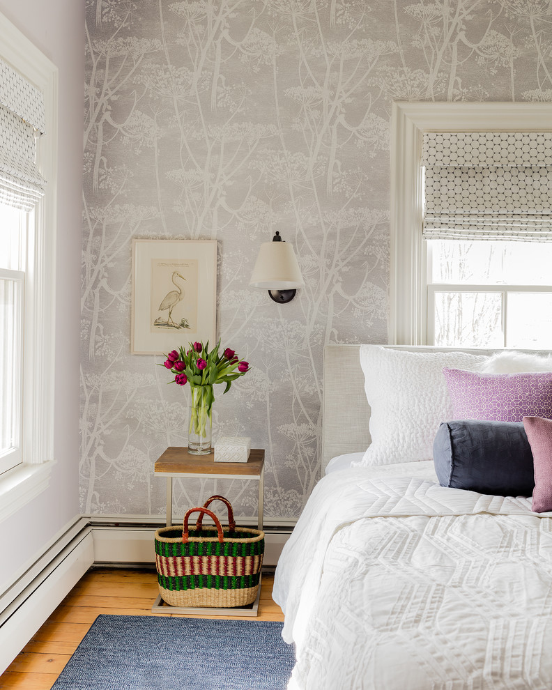 Inspiration for a small transitional master bedroom in Boston with multi-coloured walls and medium hardwood floors.