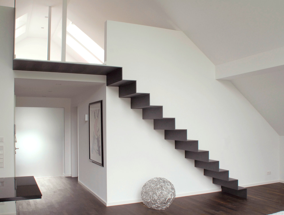 Inspiration for a mid-sized contemporary metal straight staircase in Nuremberg with metal risers.
