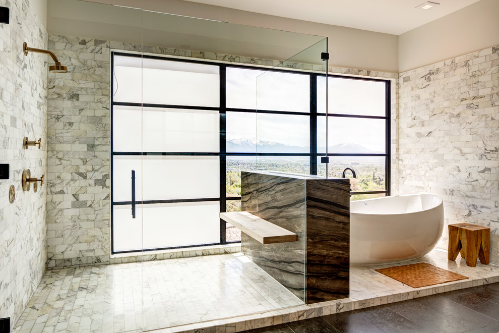 This is an example of a midcentury master bathroom in Salt Lake City with a freestanding tub, an open shower, multi-coloured tile, grey walls, multi-coloured floor and an open shower.