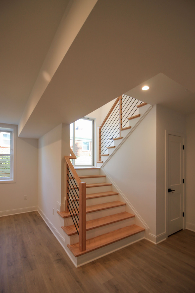 Photo of a medium sized contemporary wood floating mixed railing staircase in DC Metro with painted wood risers and tongue and groove walls.