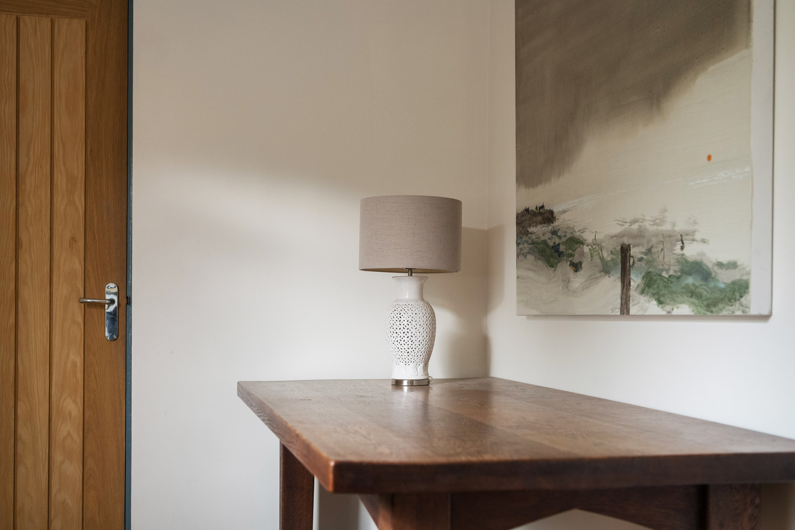 Table, lamp and painting