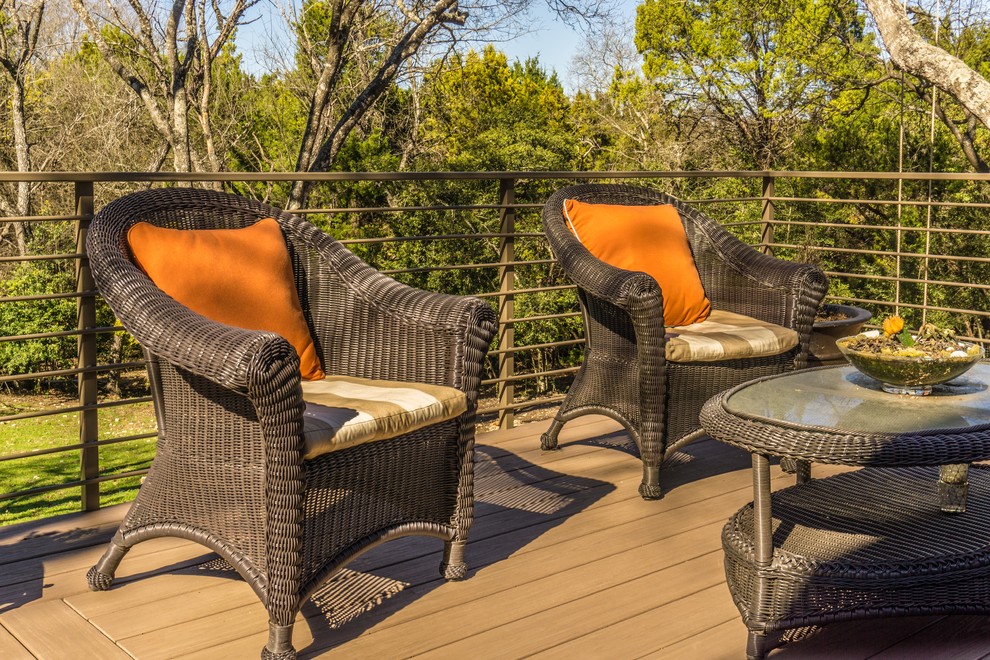 Example of a large trendy backyard deck design in Austin with no cover