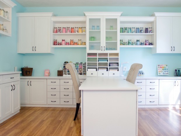 Large contemporary craft room in Nashville with blue walls, medium hardwood floors, no fireplace and a built-in desk.