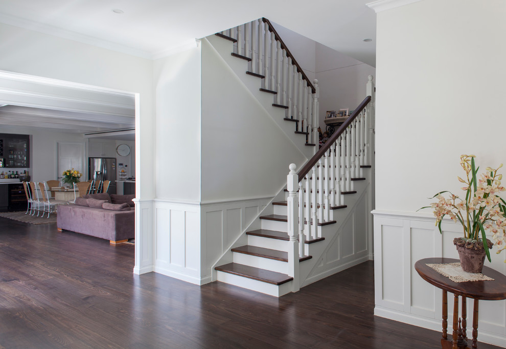 Design ideas for a mid-sized transitional wood u-shaped staircase in Melbourne.