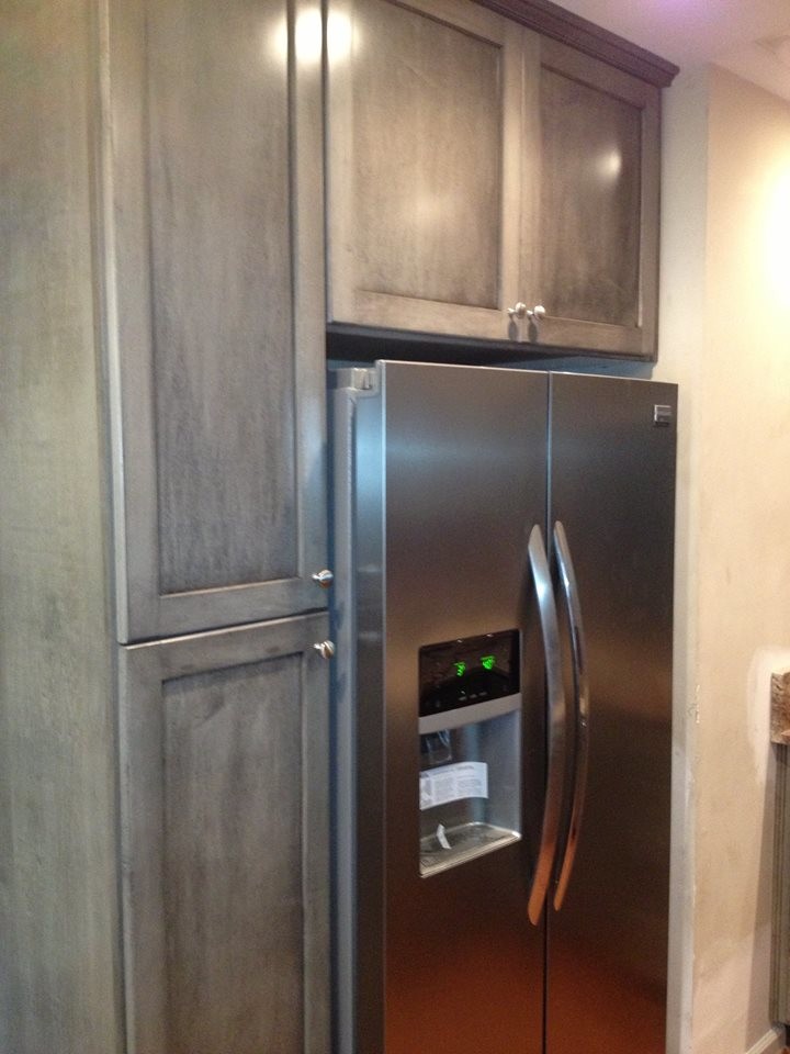 Inspiration for a mid-sized kitchen remodel in DC Metro with distressed cabinets and stainless steel appliances