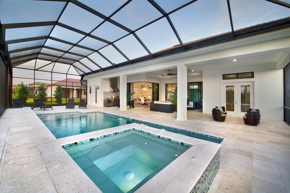 This is an example of a contemporary indoor rectangular pool in Other with a hot tub and tile.