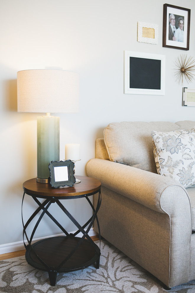 Example of a mid-sized transitional formal and enclosed light wood floor home design design with beige walls, a corner fireplace, a tile fireplace and no tv