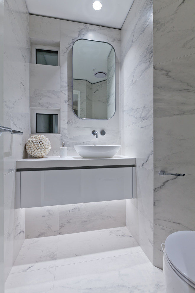 This is an example of a large contemporary powder room in Perth with flat-panel cabinets.