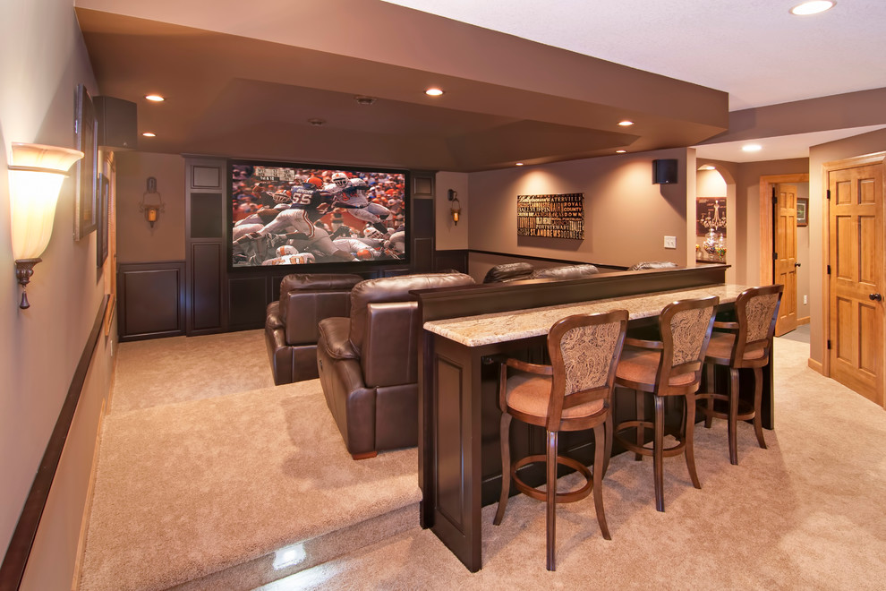 Photo of a large traditional enclosed home theatre in Minneapolis with brown walls, carpet and a built-in media wall.