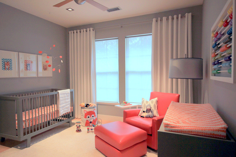 Mid-sized contemporary gender-neutral nursery in Los Angeles with grey walls and light hardwood floors.